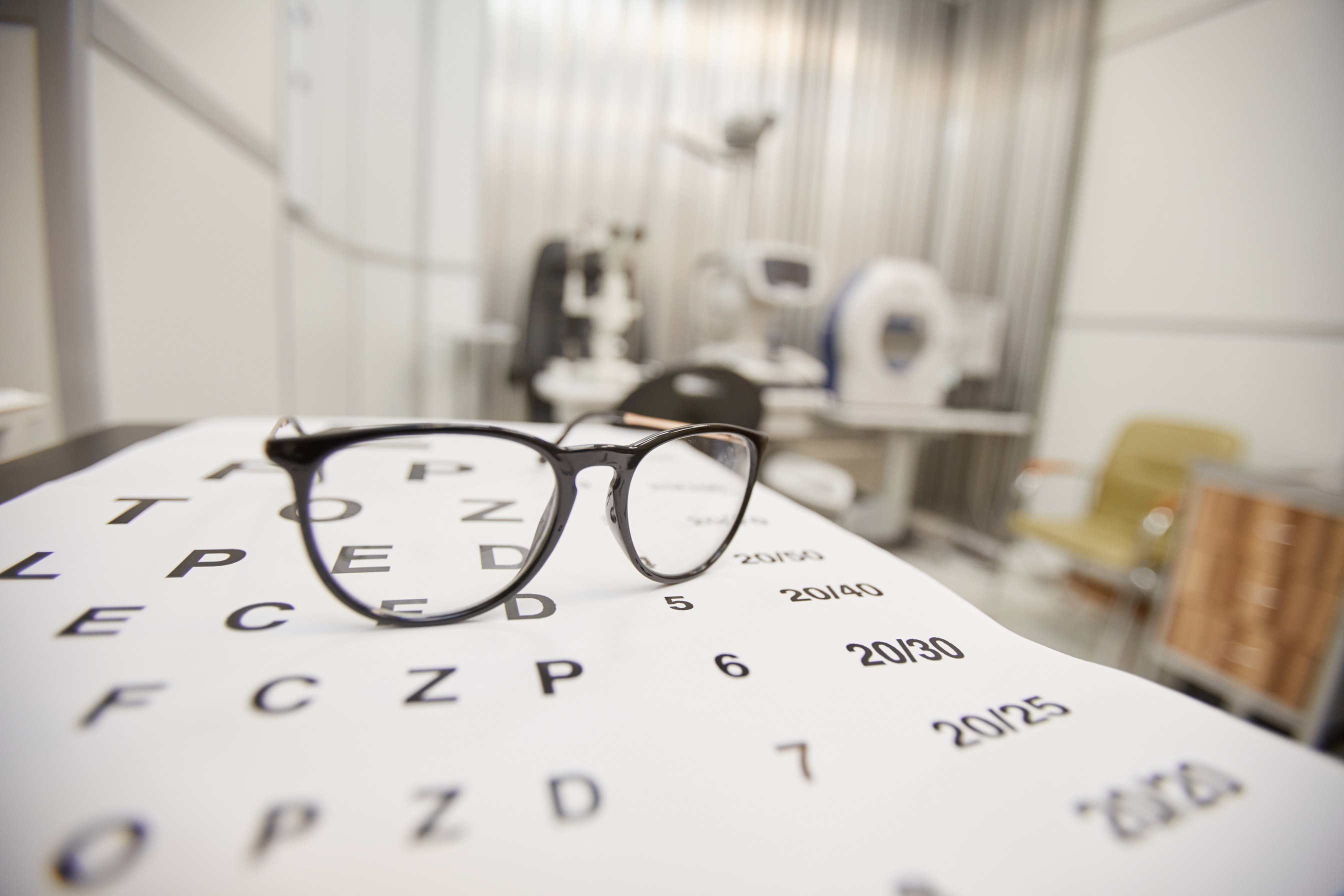 Eye Glasses on Vision Test Background